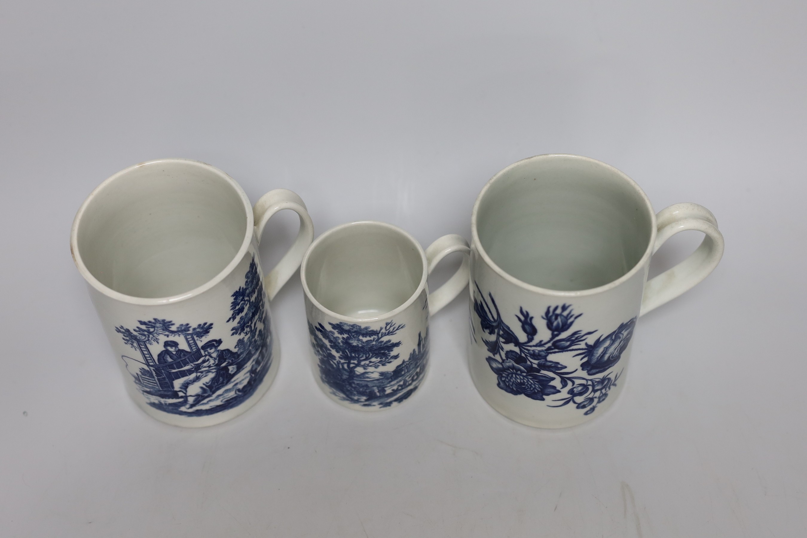 Three 18th century Worcester mugs, Three flowers, La Promenade, 12.5cms high
